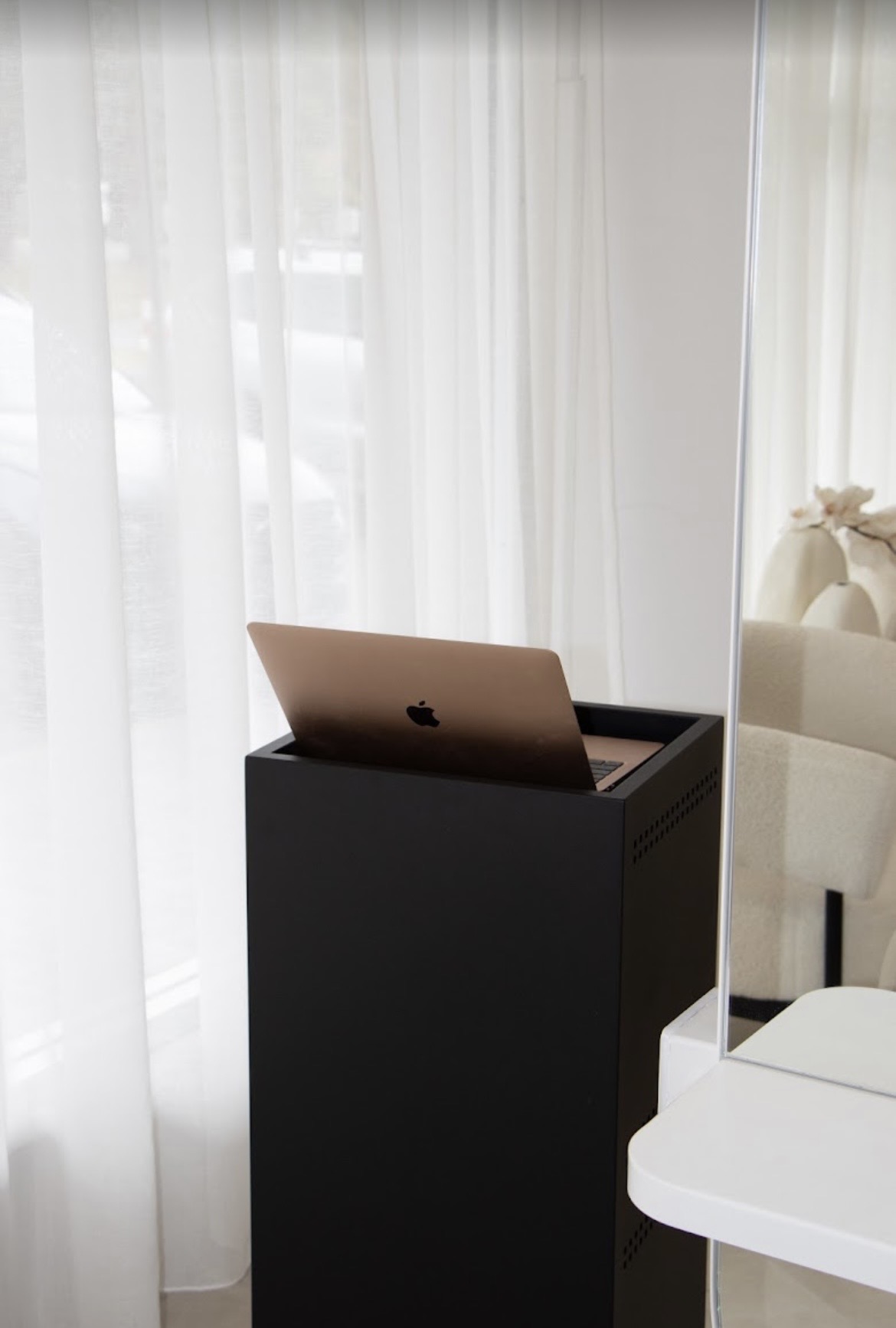 Reception desk by the sheer curtains at HONEY.